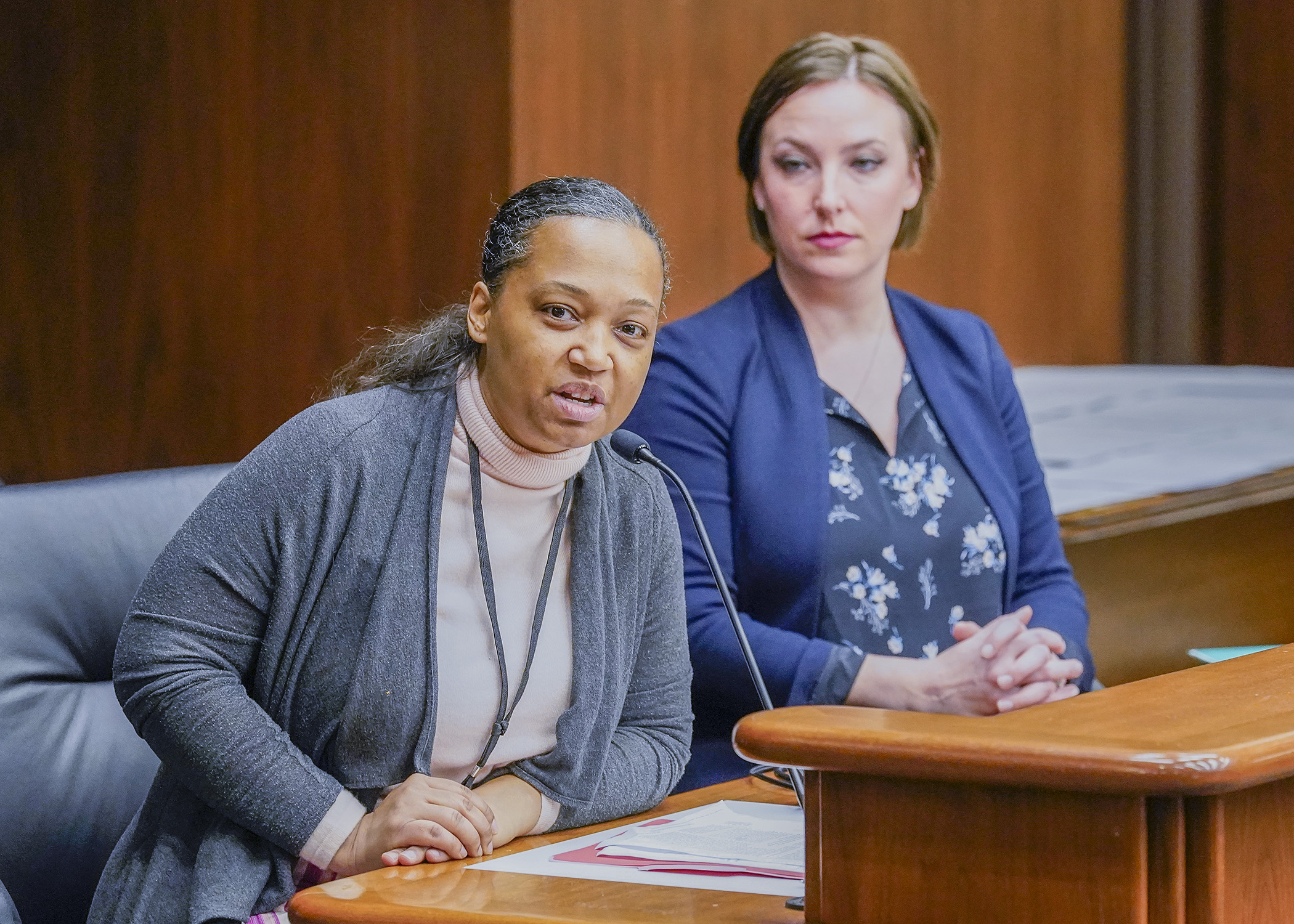 Health Commissioner Brooke Cunningham, left, testifies Jan. 5 before the House Health Finance and Policy Committee in support of a bill sponsored by Rep. Carlie Kotyza-Witthuhn, right, that would codify abortion rights. (Photo by Andrew VonBank)